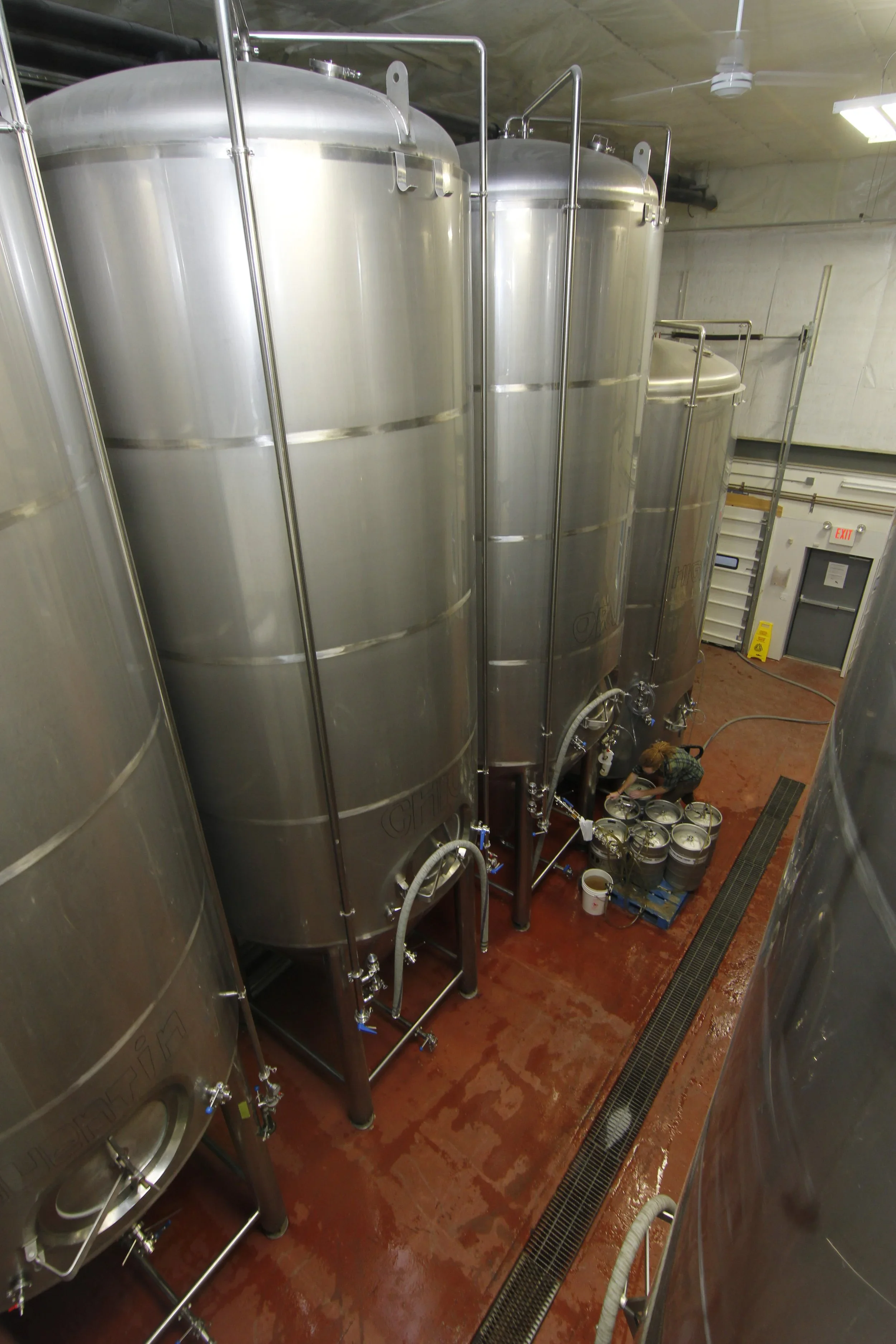 Fermentation tanks inside Denali Brewing production facility