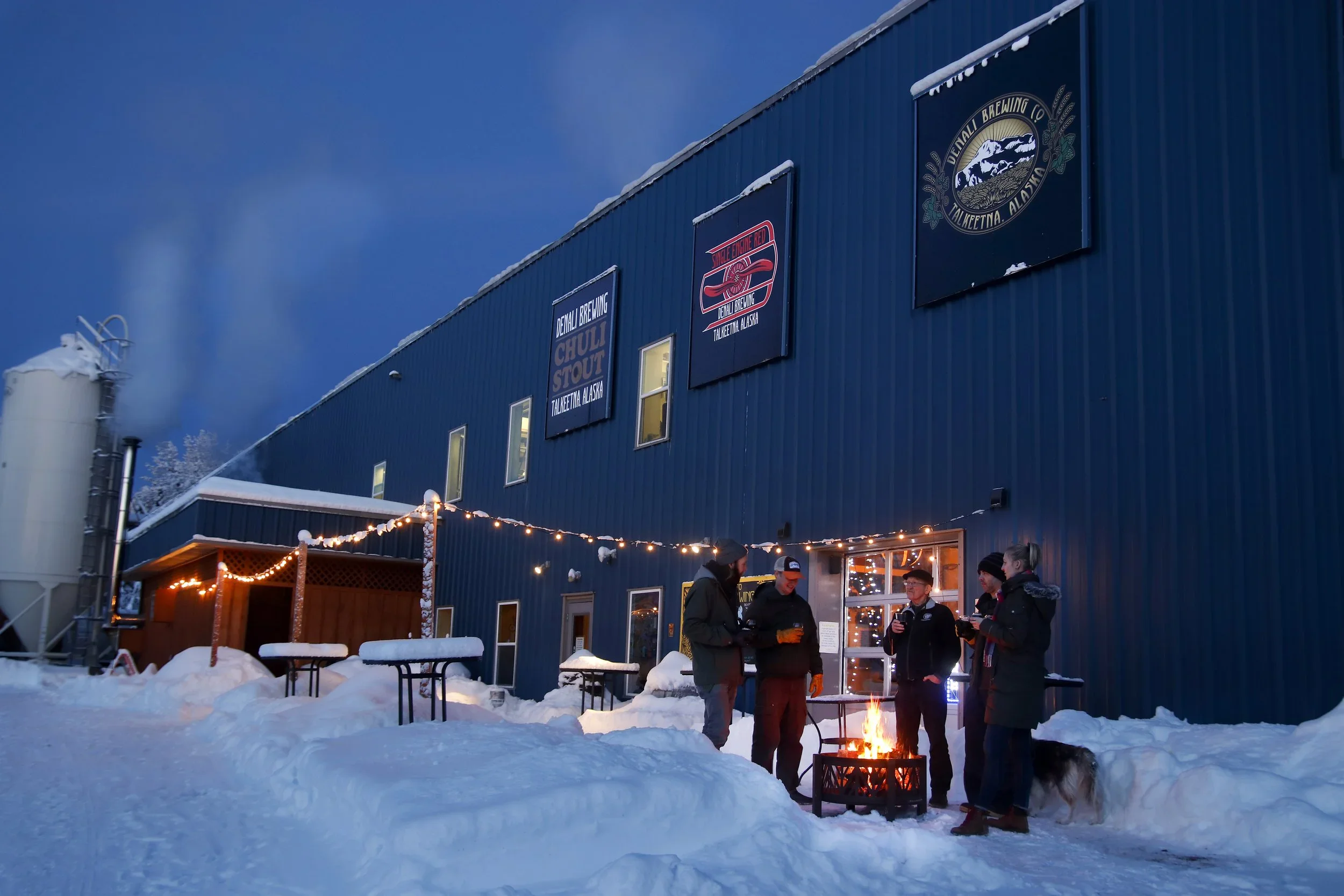 Denali Brewing Team gathered at the brewery in winter